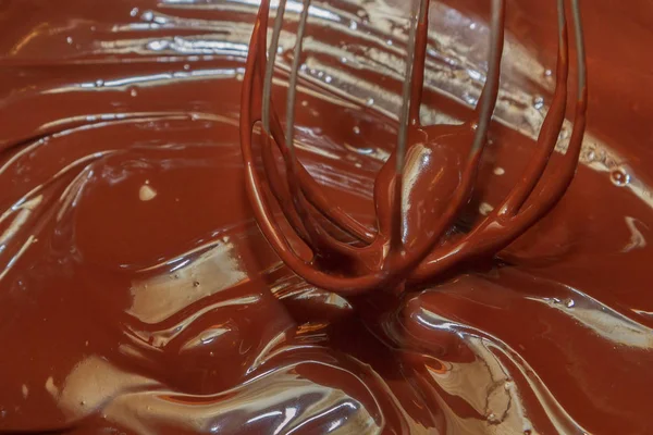 Bitter chocolate is heated in a bowl for dessert — Stock Photo, Image