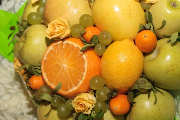 Fruit and floral green bouquet with apples and citrus