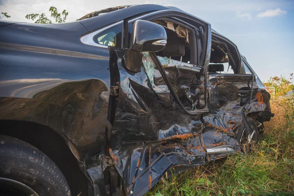 crashed doors of off-road car after the accident are on the sidelines.