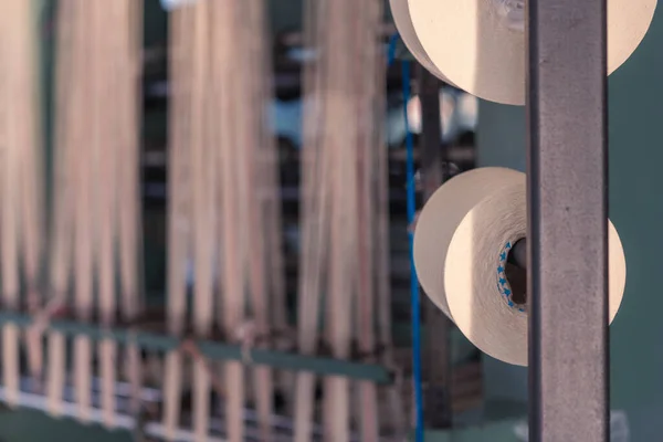 mechanical equipment at a garment factory. thread manufacturing tools.