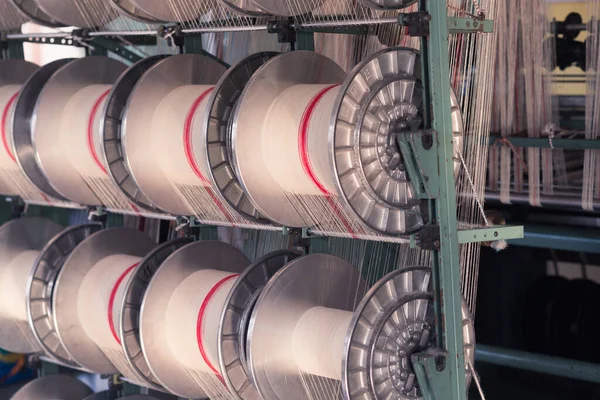 mechanical equipment at a garment factory. thread manufacturing tools.