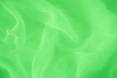 Teal ipek kumaş perdeler, zarif dalgalar, arka plan, tekstil tasarımı. Düz, parlak dokusunu sergileyen, deniz mavisi bir kumaşın yakın plan çekimi.