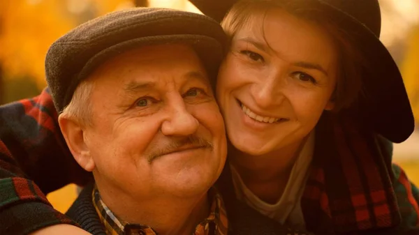 Happy portrait of young woman and her senior father — Stock Photo, Image