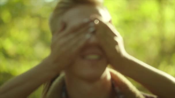 Girlfriend meeting his boyfriend on the date. Closing eyes with hands — Stock Video