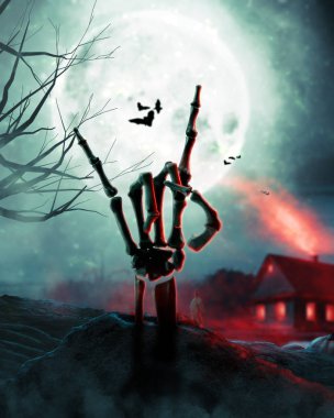 Cadılar Bayramı kutlaması. Cadıların evinin arka planında iskelet el var.