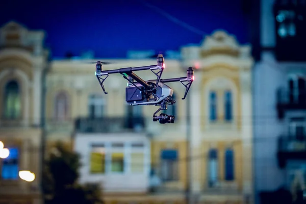 Drone lands on the street flying around city