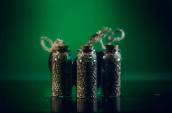 Bottles Spices Stand Mirror Surface Green Background — Stock Photo, Image