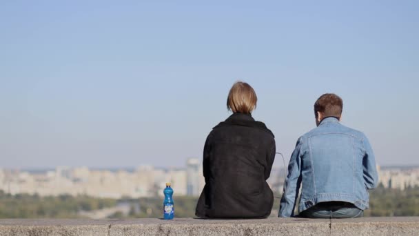 Couple Sits Overlooking City Kiev — Stock Video