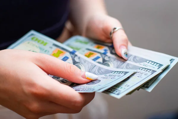 Close-up Hands counting money American dollars , Counting money American dollars with hand , Vintage tone effect , Income and Business concept.