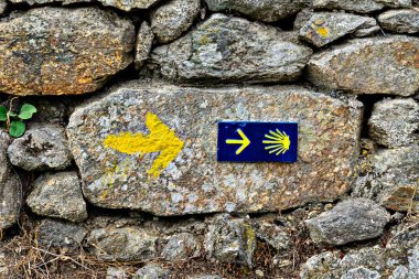 Shell sign and arrow of ancient pilgrim routes The Way of Saint  clipart