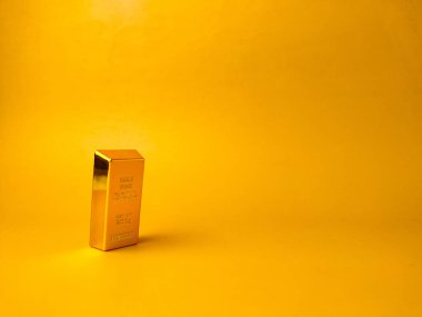 The image displays a gold bar on a yellow background with copy and text space.