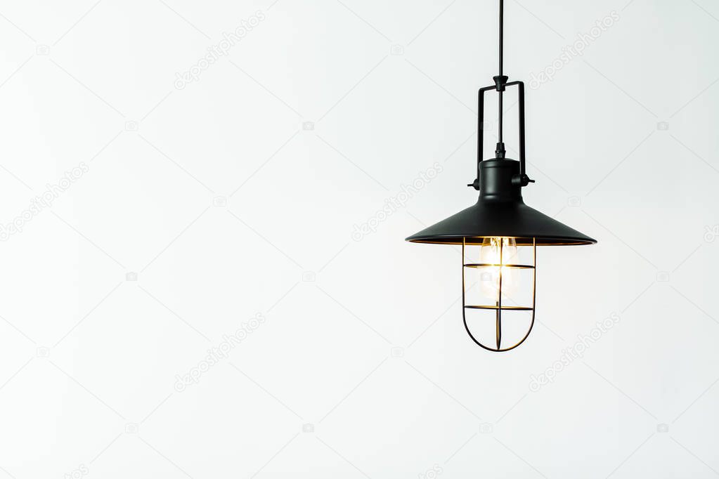 light bulb with retro steel lamp on white background