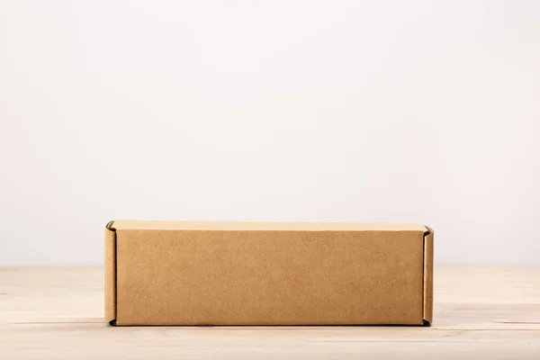 Blank Label Cardboard Box Wooden Table — Stock Photo, Image