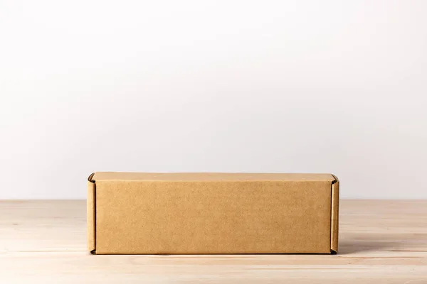Blank Label Cardboard Box Wooden Table — Stock Photo, Image