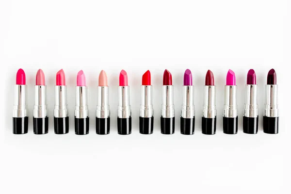 Set of color lipsticks on white background. Professional decorative cosmetics, product pomade for advertising. beauty, fashion. flat lay, top view — Stock Photo, Image