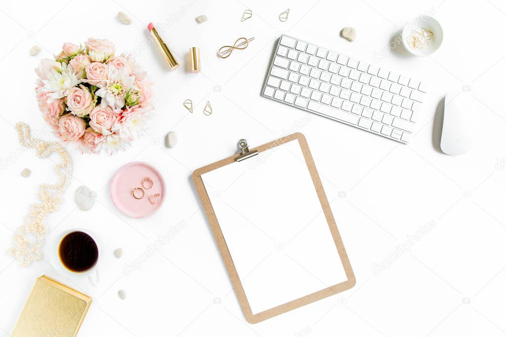 Stylized womens desk, office desk. Workspace with, laptop, roses, clipboard. Womens fashion accessories on white background. Flat lay Top view