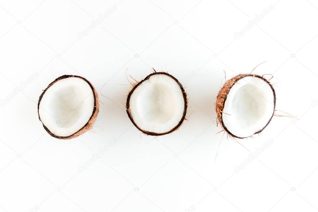 Pattern with coconuts on white background. Tropical abstract background. Flat lay, top view.