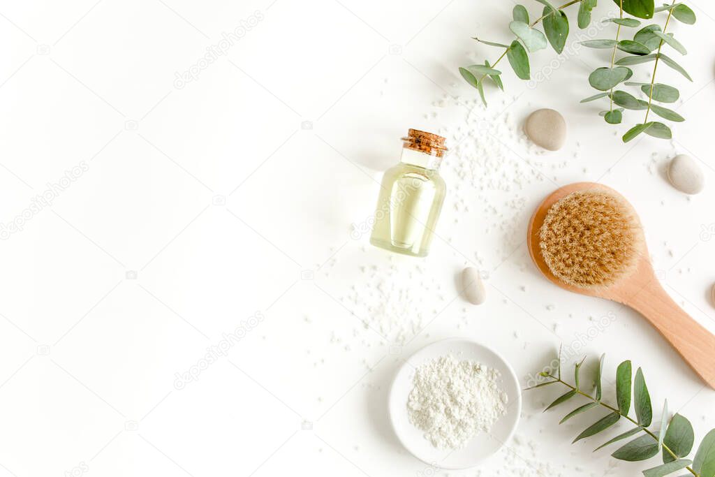 Spa Background. Natural, Organic spa cosmetics products, eco friendly bathroom accessories, eucalyptus leaves. Skincare concept on white background. 