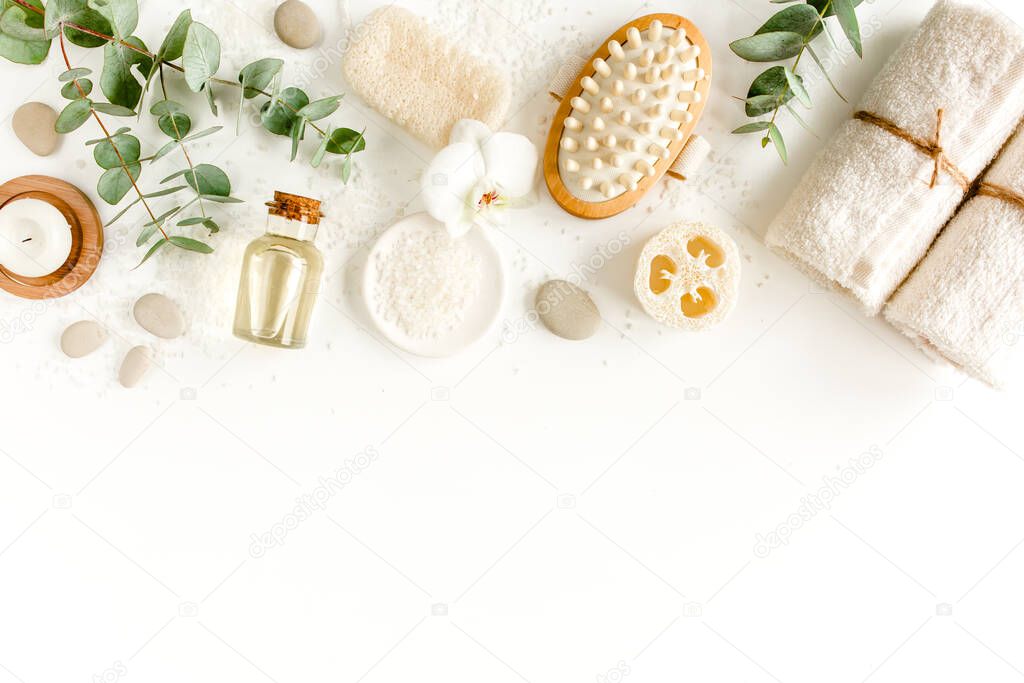 Spa Background. Natural, Organic spa cosmetics products, eco friendly bathroom accessories, eucalyptus leaves. Skincare concept on white background. 