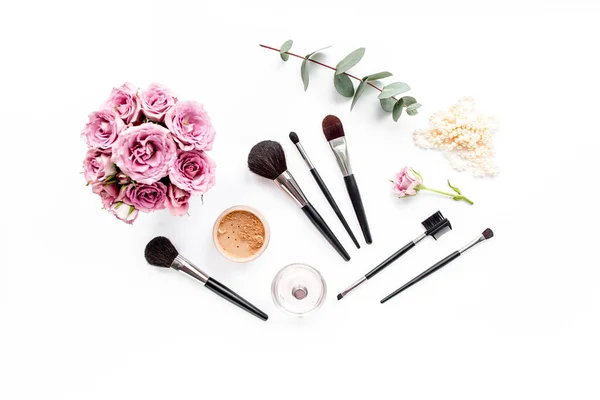 Makeup tools. Home office workspace. Female fashion, makeup brushes, cup of coffee on white background. Flat composition. Top view. Flat lay. — Stock Photo, Image
