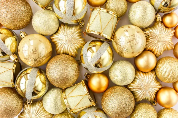 Christmas texture: golden glass christmas balls on white background. flat lay, top view Stock Photo