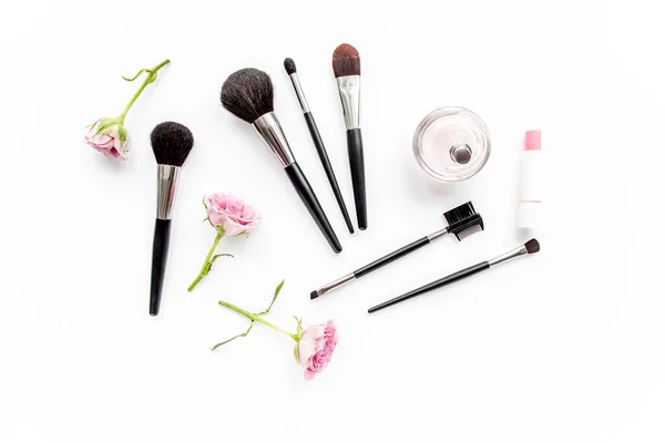 Makeup tools. Home office workspace. Female fashion, makeup brushes, cup of coffee on white background. Flat composition. Top view. Flat lay. — Stock Photo, Image