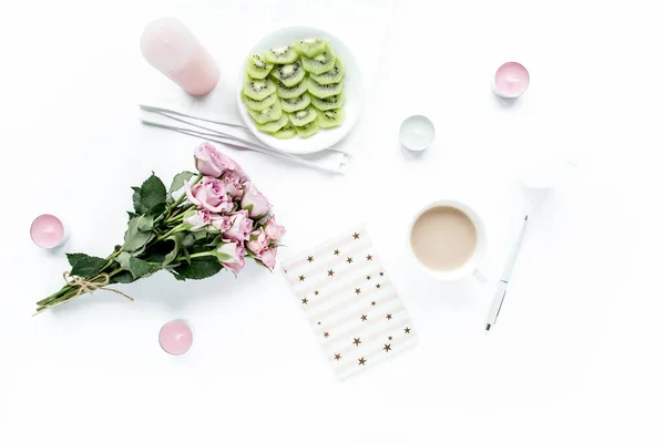 Makeup tools. Home office workspace. Female fashion, makeup brushes, cup of coffee on white background. Flat composition. Top view. Flat lay.