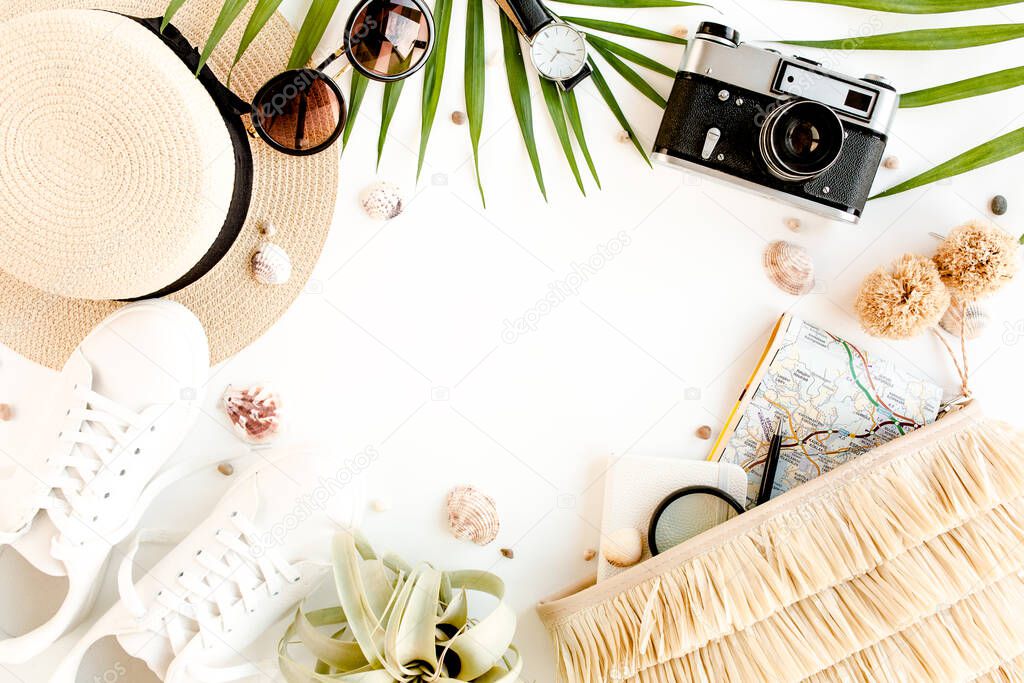 Top view on traveler accessories on white background. Essential vacation items, Travel concept background. 