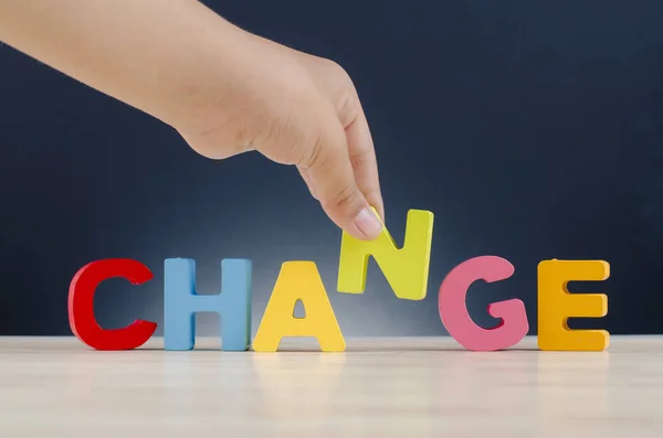 Hand holding alphabet N to complete word CHANGE. — Stock Photo, Image