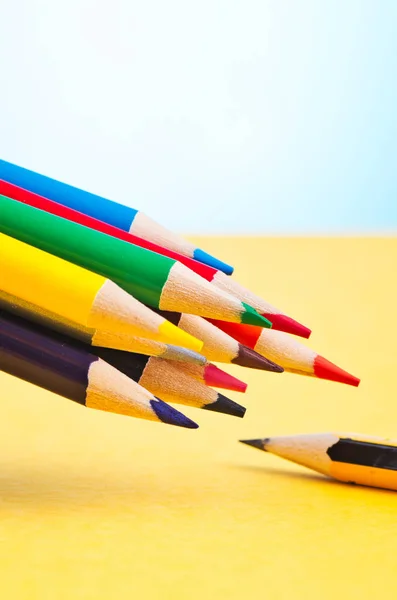 Colourful pencils over beautiful reverberation gradient background — Stock Photo, Image