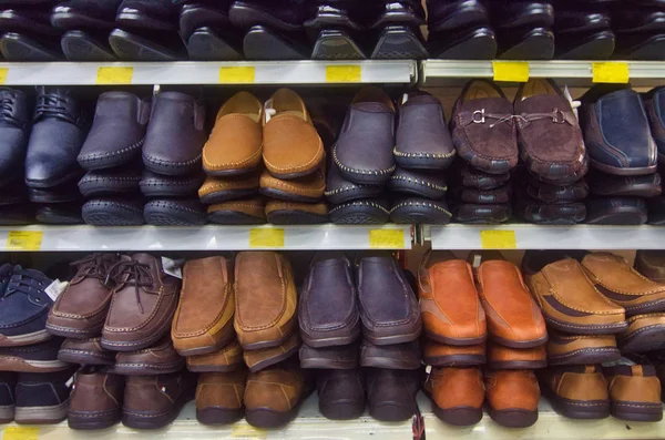 Variety shoe for man display on shelf in the store.