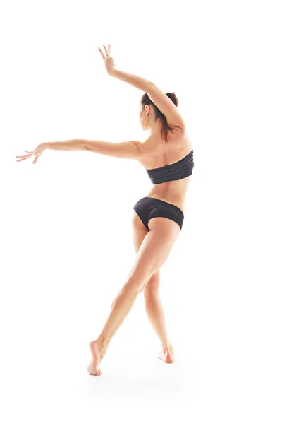 Young beautiful baliet dancer posing on a studio — Stock Photo, Image