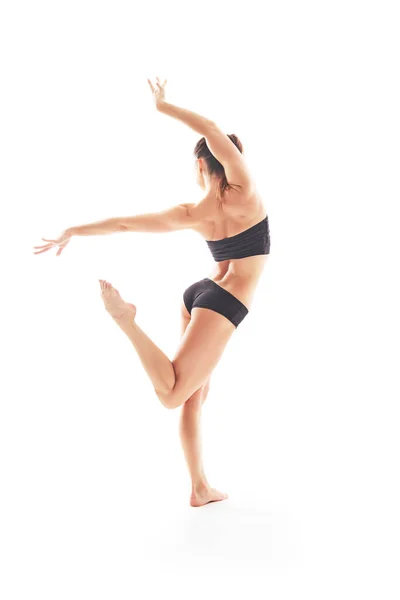 Young beautiful baliet dancer posing on a studio — Stock Photo, Image