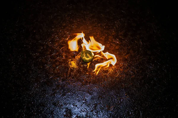 Combustion of fuel. Flame of fire on the asphalt. — Stock Photo, Image