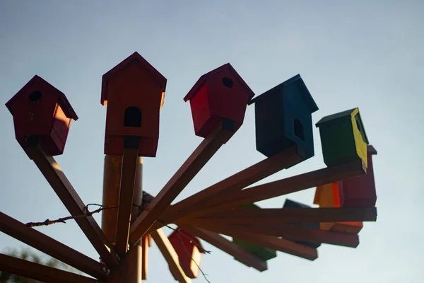 Bird houses. Colored birdhouses on the street.