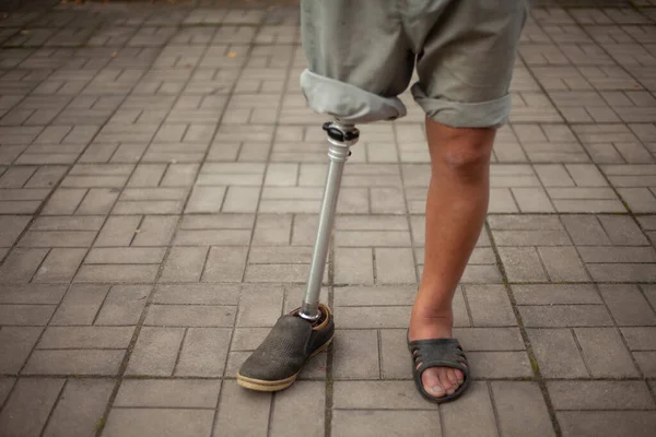 Metal prosthetic leg. Simple prosthetics for a man\'s leg.