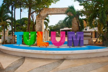 TULUM, MEXICO: Outdoor view of huge colorful letters of Tulum at the enter of Mayan Ruins of Tulum in Meixco. clipart