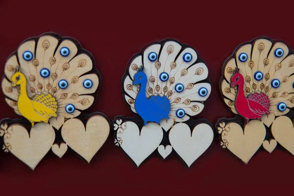 Peacock and hearts. Beautiful handmade Souvenirs made of wood. A traditional Turkish market, Bazaar. Turkey, Eskisehir.