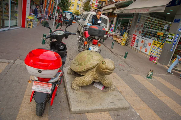 Eskisehir, Turkey: The sculpture of a turtle, motorcycles on the street. Eskisehir is a modern city in center of Anatolia.