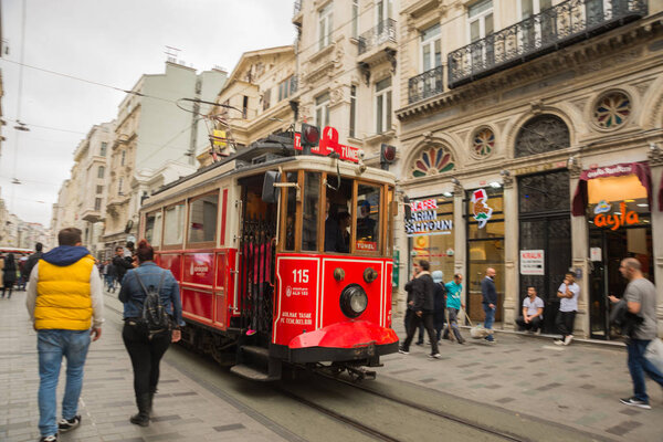 ISTANBUL, TURKEY: Retro tram on Istiklal street. Istanbul historic district. Istanbul famous touristic line. Red tram Taksim-Tunel.