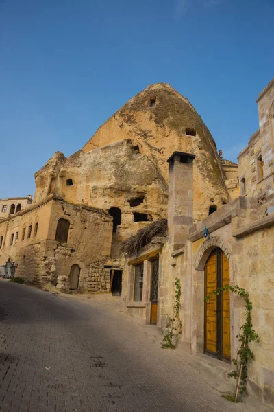 Goreme, Cappadocia, Turkey: Famous cave hotels in Goreme. Beautiful panorama of the city. Landscape with view of cave houses