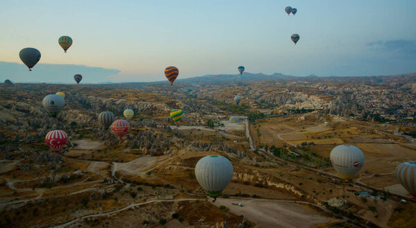 Cappadocia, Turkey: Balloon flight at dawn, beautiful view of the mountains and balls. Hot air balloon flying over spectacular Cappadocia under the sky.