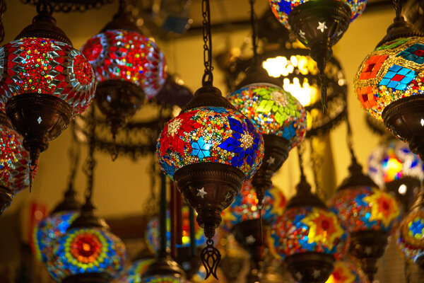 Traditional bright decorative hanging Turkish lights and colourful light lamps with vivid colours in Turkey.