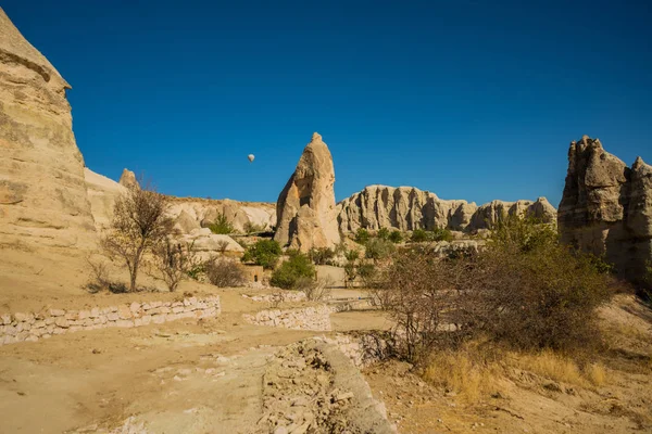 Cappadocia, Turkey: Flying in a balloon. Mountain view in summer in Sunny weather. The great tourist attraction of Cappadocia - balloon flight.