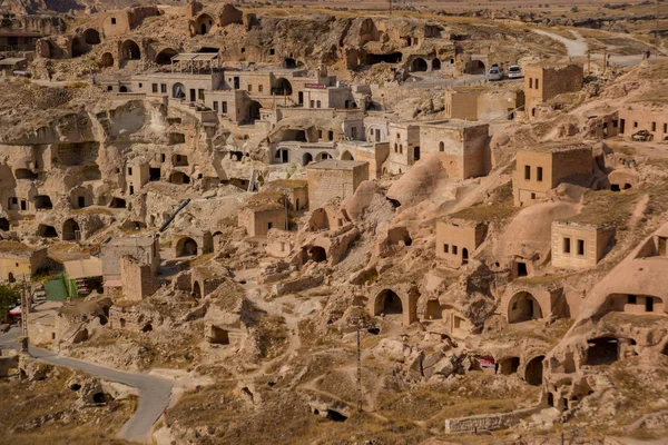 Top view of the village with houses in the rocks. Cavusin near Goreme in Cappadocia, Anatolia. Turkey