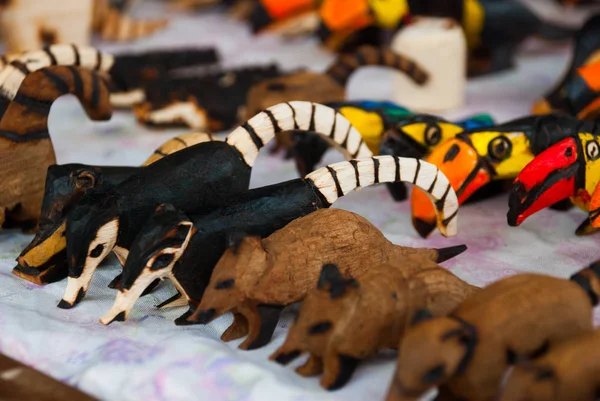 Argentina Souvenirs from the market, crafts made of wood. Beautiful colorful animals.