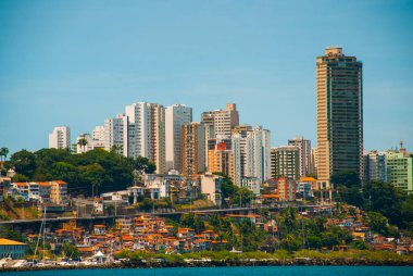 SALVADOR, BAHIA, BRAZIL: Beautiful Landscape with beautiful views of the city from the water. Houses, skyscrapers, ships and sights. clipart