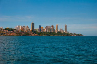 SALVADOR, BAHIA, BRAZIL: Beautiful Landscape with beautiful views of the city from the water. Houses, skyscrapers, ships and sights. clipart