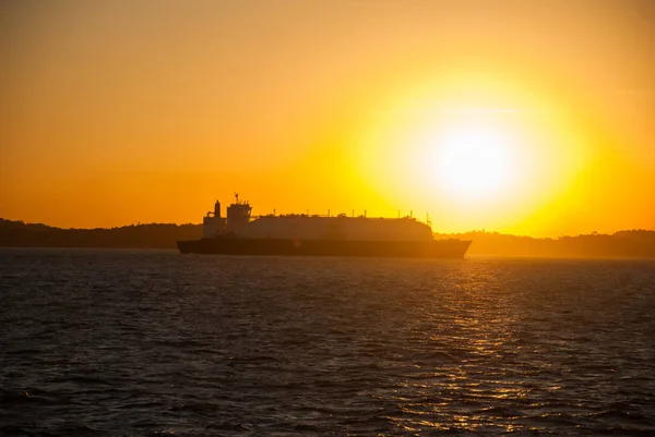 Freighter ship in the Bay of All Saints in Salvador de Bahia, Brazil, sunset