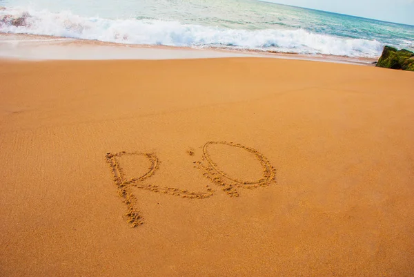 BRAZIL: Inscription on the sand, drawing with the name of the city of Rio de Janeiro — Stock Photo, Image